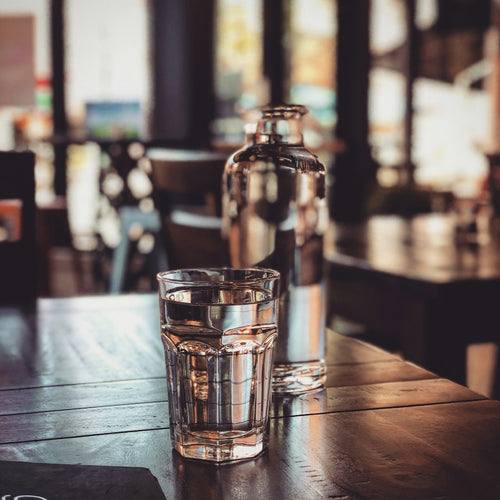 Bedside Glass Carafe & Tumbler — photo by Clint McKoy on Unsplash
