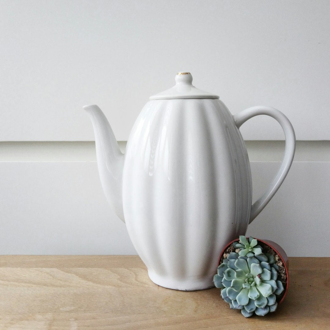 Stoneware Teapot 900ml — photo by Natalia Ventskovskaya on Unsplash