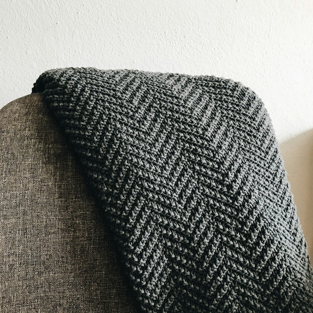 Wool Throw Blanket — Charcoal — photo by rocknwool on Unsplash